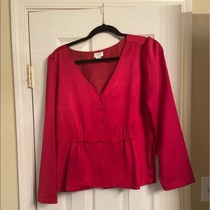 Red three quarter sleeve blouse with front button detail. Size 12